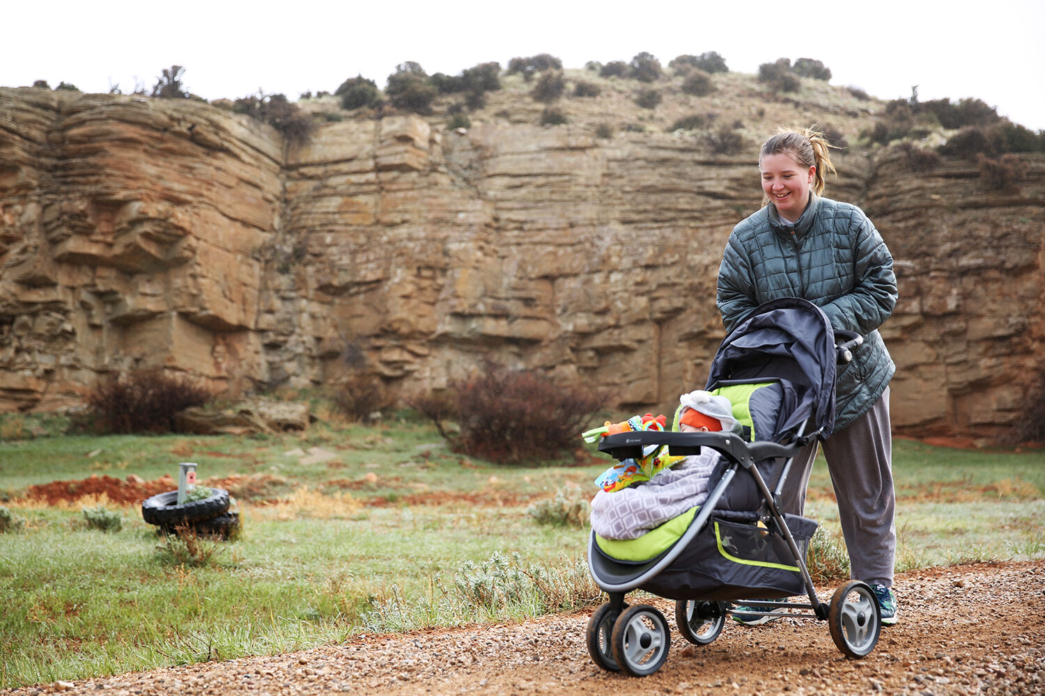 Anne Ables pushes her six-month-year-old son Demitri in a stroller